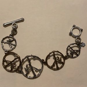 Lucky Brand Peace sign bracelet. Silver and gold